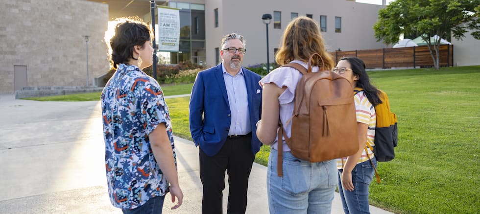 President Thomas with students